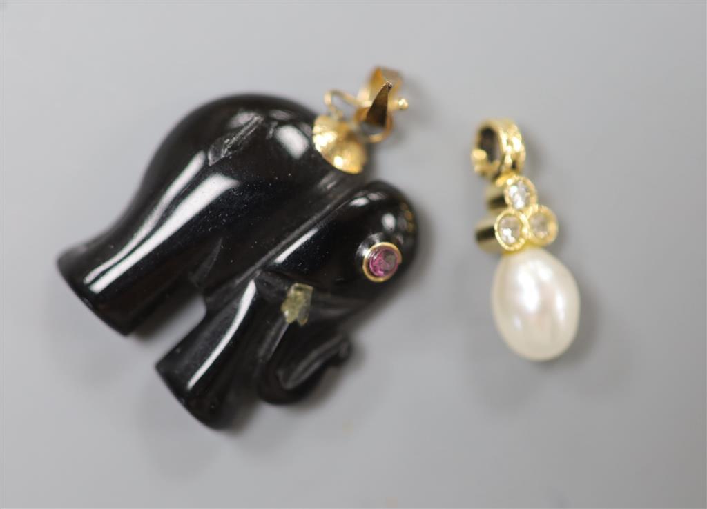 A modern yellow metal, single cultured pearl and three stone diamond chip set pendant, 16mm, gross 0.8 grams & elephant charm.